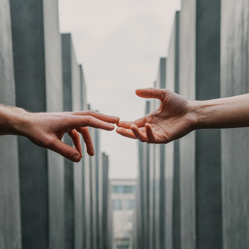 hands reaching out to each other
